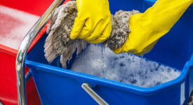 Cleaning concept. Closeup photo of woman cleaning at the office