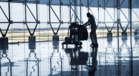 Barcelona City – Spain. May 20-2010:  Cleaning staff at Barcelona Terminal Airport lobby. Building architectural detail designed by spanish achitect Richard Bofill .