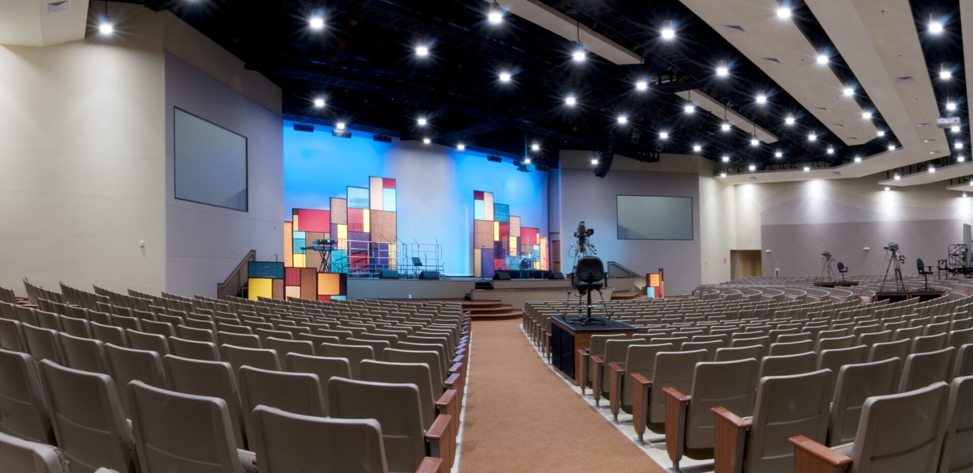 Panorama of Church Interior with Lit Stage.